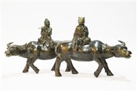 Lot 26 - Pair of bronze water buffalo ornaments.