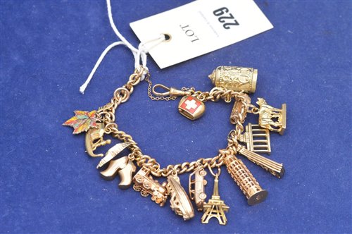 Lot 229 - 18ct yellow gold charm bracelet
