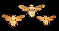 Lot 482 - Three gold bee brooches, boxed
