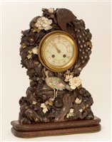 Lot 676 - A rare and unusual Japanese carved mantel clock.
