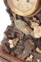 Lot 676 - A rare and unusual Japanese carved mantel clock.