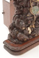 Lot 676 - A rare and unusual Japanese carved mantel clock.