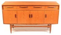 Lot 65 - A teak sideboard.