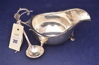 Lot 317 - Silver sauceboat and ladle
