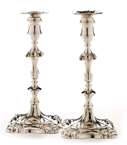 Lot 422 - A pair of George III candlesticks.