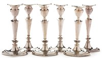 Lot 400 - Composite set of six candlesticks