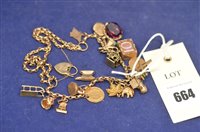 Lot 664 - Yellow metal charm bracelet