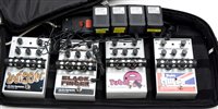 Lot 104 - Four Electro Harmonics foot pedals; and soft case.