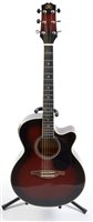 Lot 204 - An SX Electro acoustic guitar and stand
