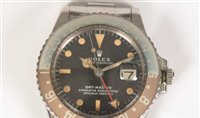 Lot 469 - Rolex GMT Master: a gentleman's stainless steel bracelet watch.