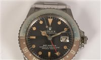 Lot 469 - Rolex GMT Master: a gentleman's stainless steel bracelet watch.