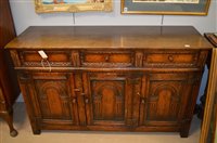 Lot 1040 - carved oak sideboard