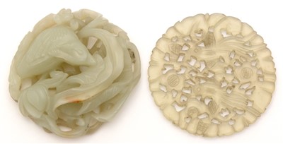Lot 39 - An early 20th Century Chinese carved pale green jade pendant, and a hardstone disc.