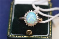 Lot 724 - Opal and diamond ring