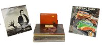 Lot 395 - Approx thirty 12" rock records and a booklet of 7" singles.