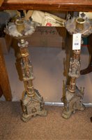 Lot 1048 - Pair of religious candlesticks