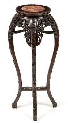 Lot 37 - A  carved Chinese hardwood jardiniere stand.