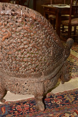 Lot 751 - An Anglo Indian carved hardwood armchair.