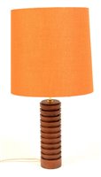 Lot 56 - A mid 20th Century teak table lamp.