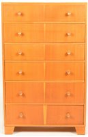 Lot 92 - W. Axelrod: a mid 20th Century oak veneered chest of six drawers.