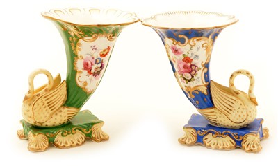 Lot 102 - Two 19th Century porcelain swan cornucopia vases.