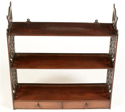 Lot 766 - A George III mahogany three-tier wall bracket.
