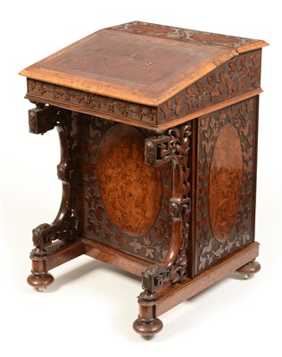 Lot 833 - A walnut Davenport.
