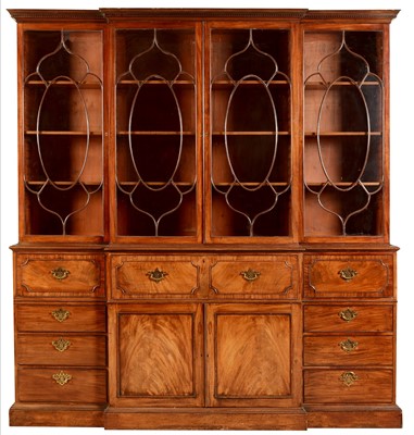 Lot 794 - A George III mahogany breakfront secretaire bookcase.