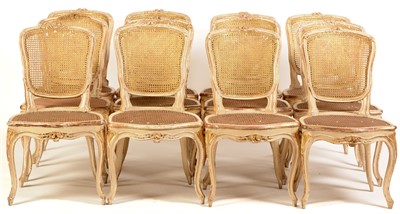 Lot 744 - A set of twelve George III parcel gilt side chairs in the Louis XV style.