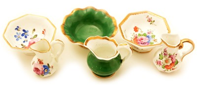 Lot 101 - Miniature bone china toilet jugs, bowls and basin.