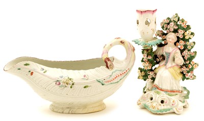 Lot 79 - A late 18th Century Derby candlestick figure; and a Derby sauce boat.