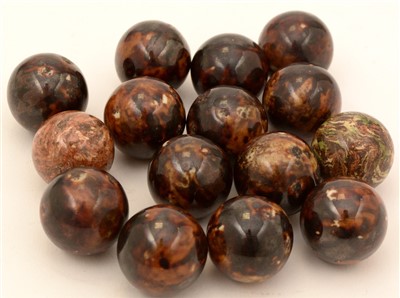 Lot 85 - Thirteen tortoiseshell glazed marbles; and two agate marbles.