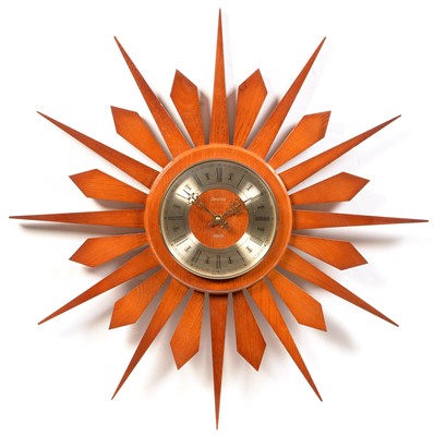 Lot 1560 - A Spectrum teak starburst pattern wall clock.