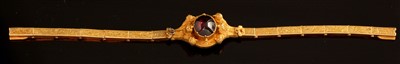 Lot 138 - Garnet and yellow metal bracelet