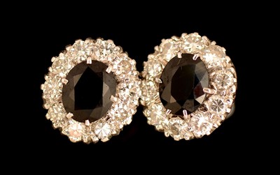 Lot 117 - A pair of sapphire and diamond earrings