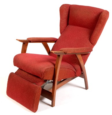 Lot 1598 - A red upholstered reclining armchair.