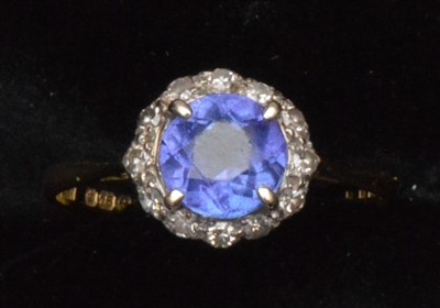 Lot 73 - Tanzanite and diamond cluster ring