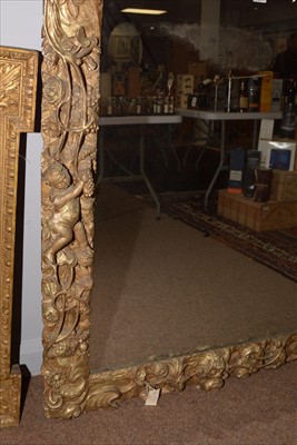 Lot 1034 - A Baroque style giltwood wall mirror