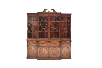 Lot 1226 - A George III mahogany breakfront secretaire bookcase.