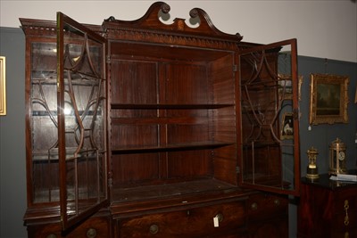 Lot 1226 - A George III mahogany breakfront secretaire bookcase.