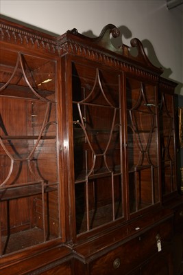 Lot 1226 - A George III mahogany breakfront secretaire bookcase.