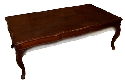 Lot 1006 - An American walnut extending dining table.