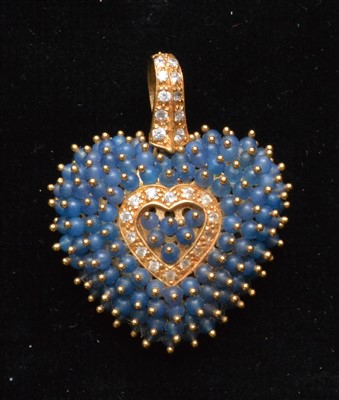 Lot 74 - A sapphire and white sapphire pendant