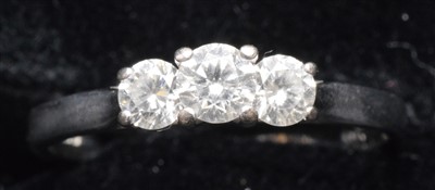 Lot 176 - A three stone diamond ring