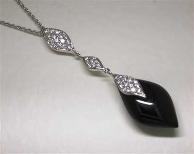 Lot 138 - Onyx and diamond pendant