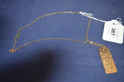 Lot 387 - Gold ingot pendant