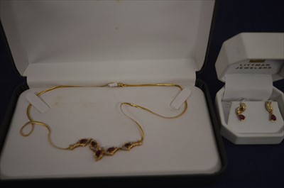 Lot 345 - A ruby and diamond necklace and earrings