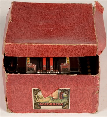 Lot 4 - Melodion and Hohner harmonica.