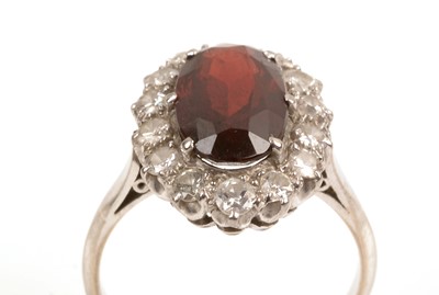 Lot 134 - Garnet and diamond cluster ring