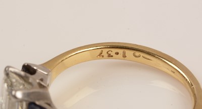 Lot 110 - A diamond and sapphire ring